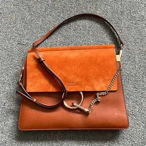Leather bag with gold medal